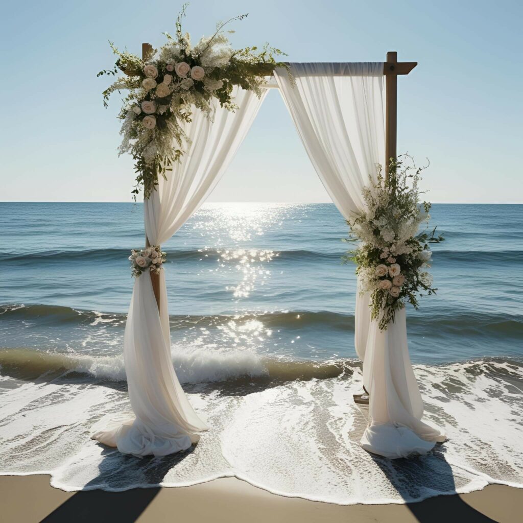 Cérémonie de mariage élégante sur la plage, arche fleurie face à l'océan en Guadeloupe – L'effet Maria wedding planner